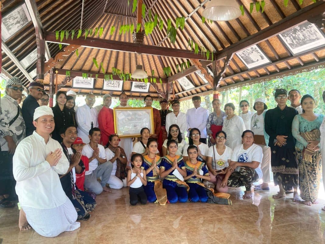 Ashram residents, teachers and guests gathered with young dancers inside an open Balinese pavilion